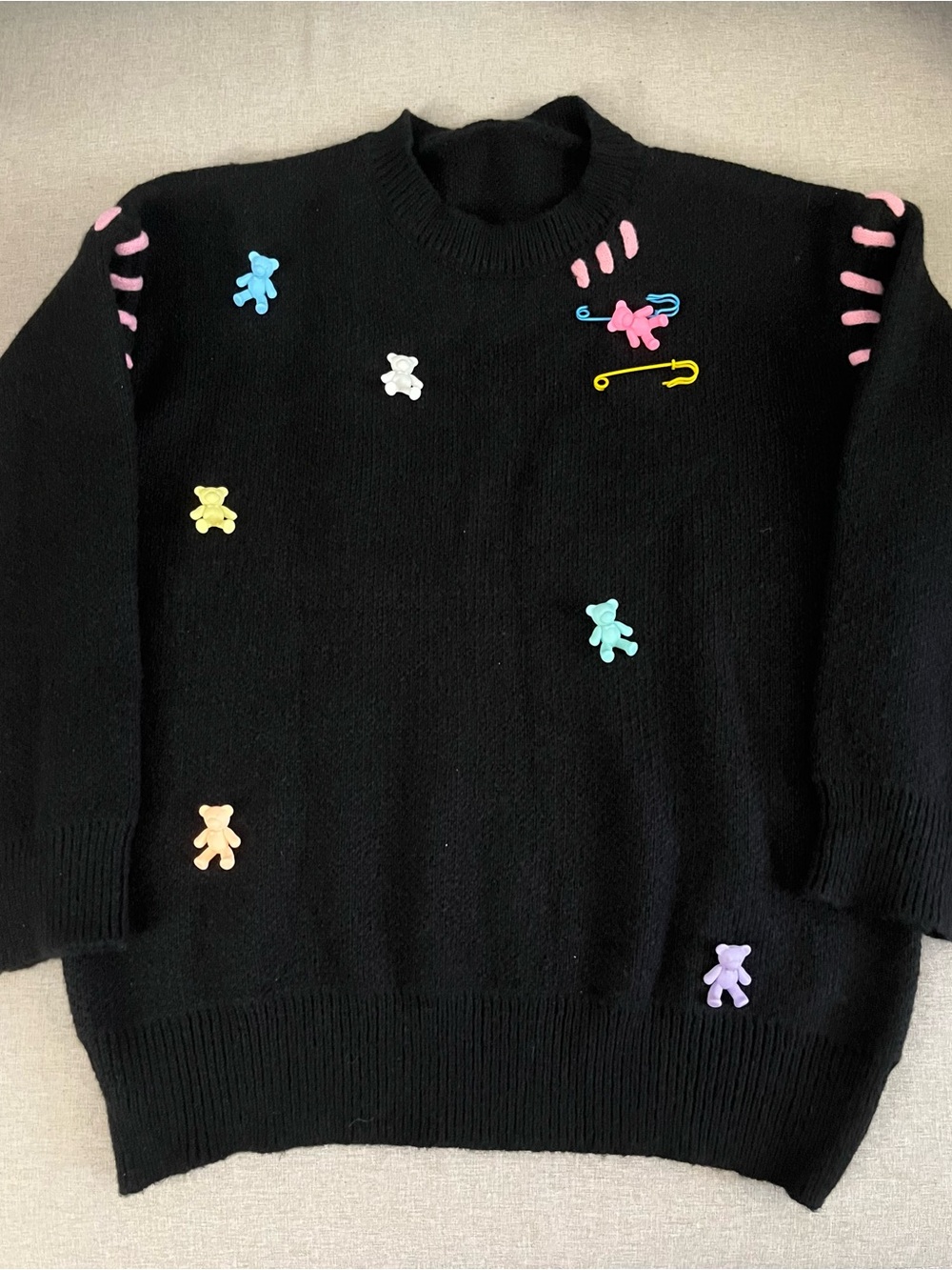 black knit sweater with 3D bear details